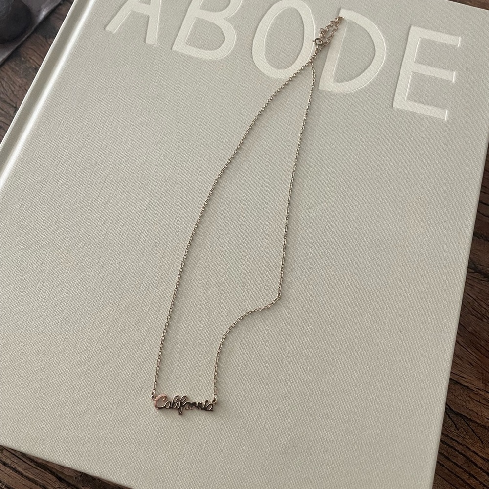 California gold necklace. Can wear in water. Dainty.